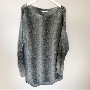 Ricki’s long thin gray sweater
